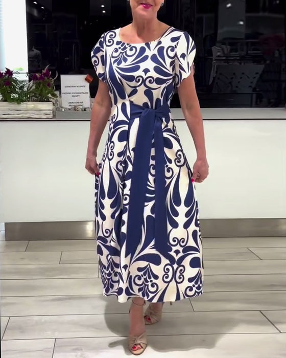 Elegante jurk met korte mouwen en contrastprint