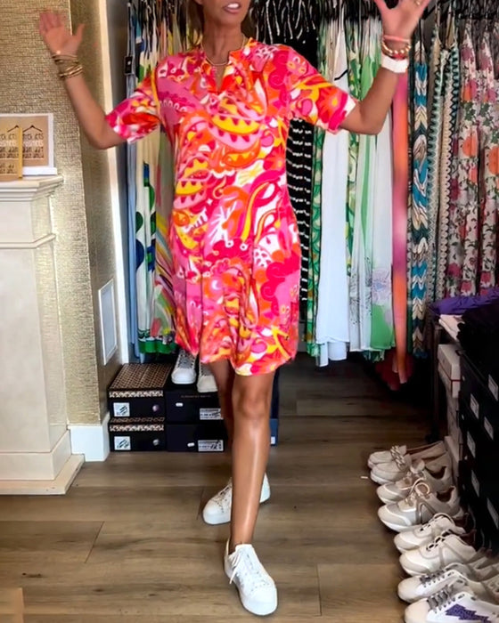 Jurk met zakken en prints en korte mouwen