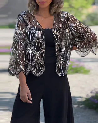 Elegante jas met lovertjes en golvende rand