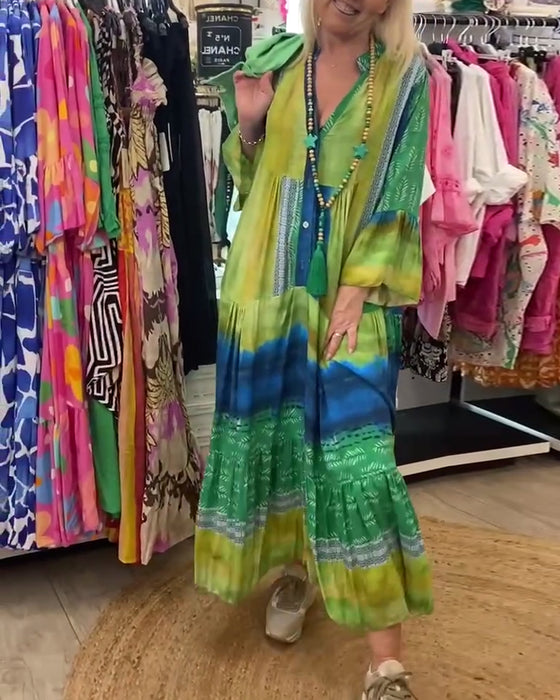 Casual lange jurk met V-hals, uitlopende mouwen en print