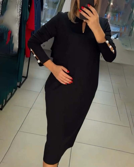 Elegante jurk met parelknopen
