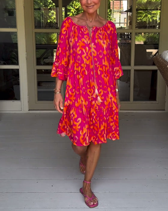 Jurk met losse print en klokmouwen