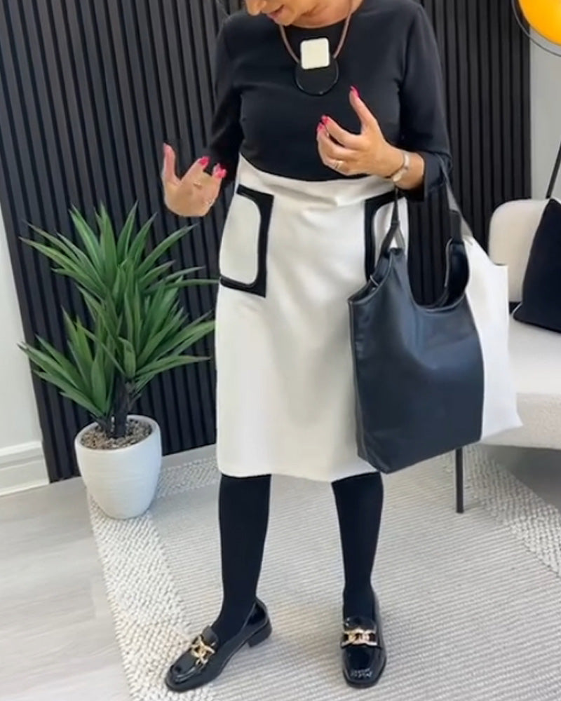 Casual contrasterende jurk met ronde hals en zak