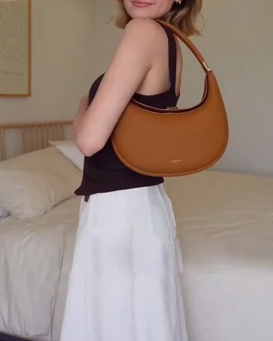 Effen kleur elegante halvemaanvormige schoudertas onder de arm