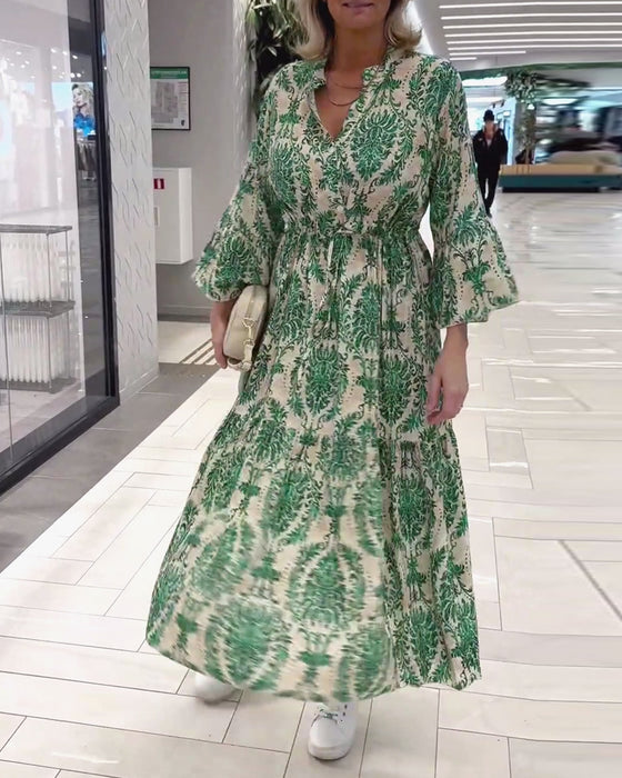 Jurk met trekkoord en klokmouwen met print