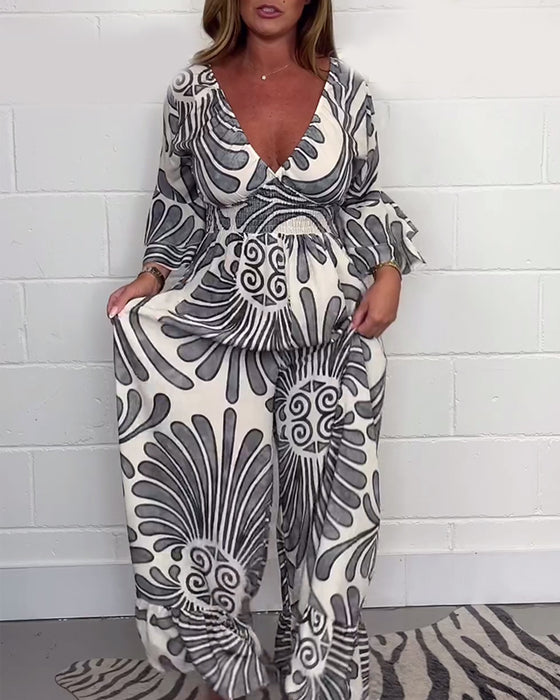 Diepe V retro bedrukte losse jumpsuit met klokmouwen