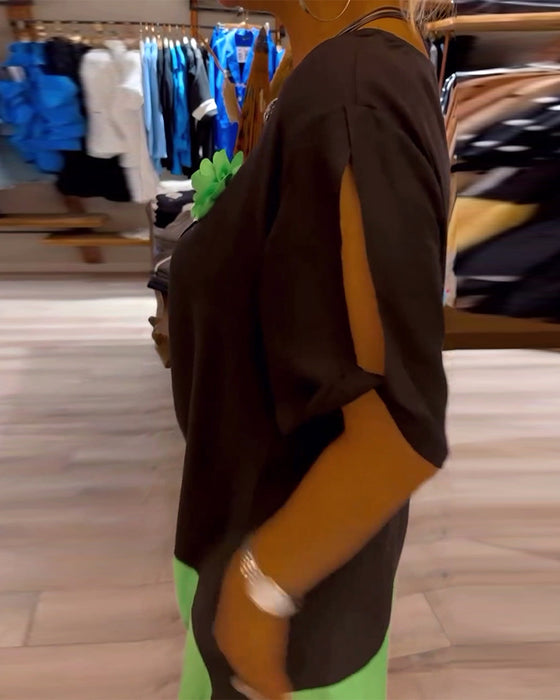 Losse patchworkjurk met ronde hals en kleurenprint