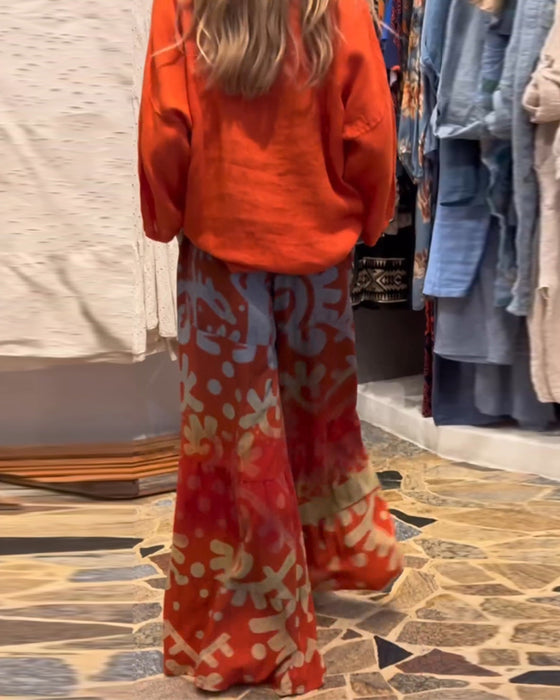 Losse broek met wijde pijpen en zak met print