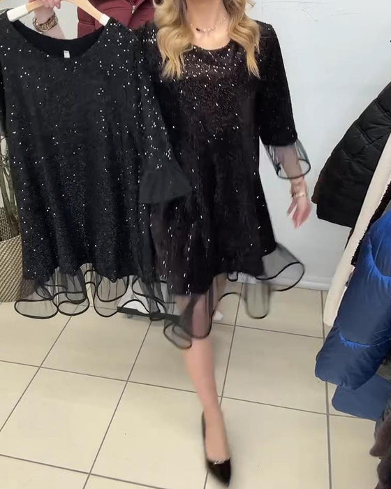 Modieuze Jurk Met Wijd Uitlopende Mouwen En Pailletten