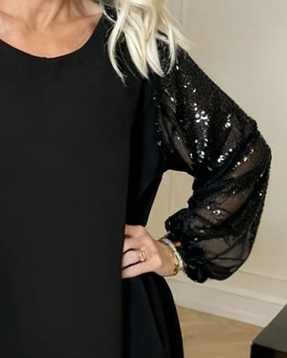 Wijde Jurk Met Lantaarnmouwen En Ronde Hals