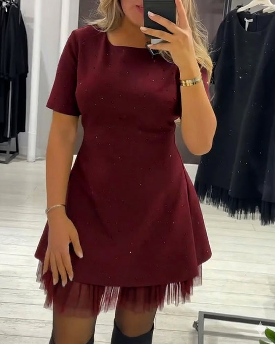 Elegante jurk met glinsterende mesh-patchwork