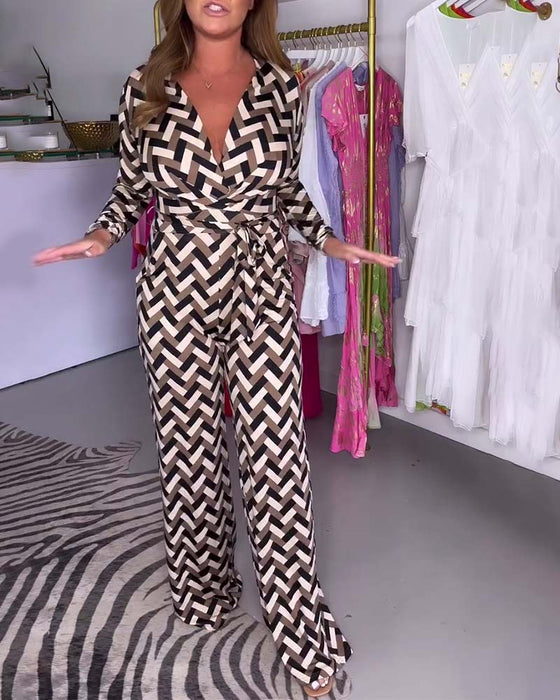 Modieuze jumpsuit met diepe V-hals en lange mouwen met print