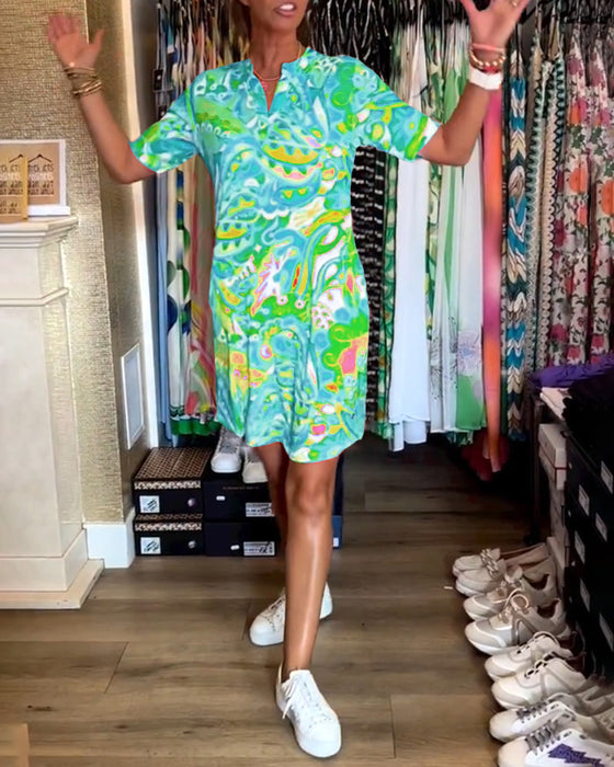 Jurk met zakken en prints en korte mouwen