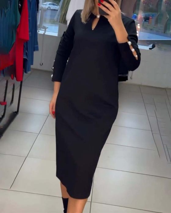 Elegante jurk met parelknopen
