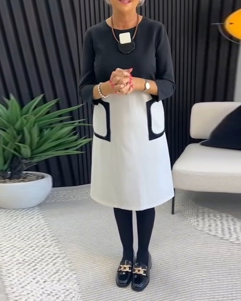 Casual contrasterende jurk met ronde hals en zak