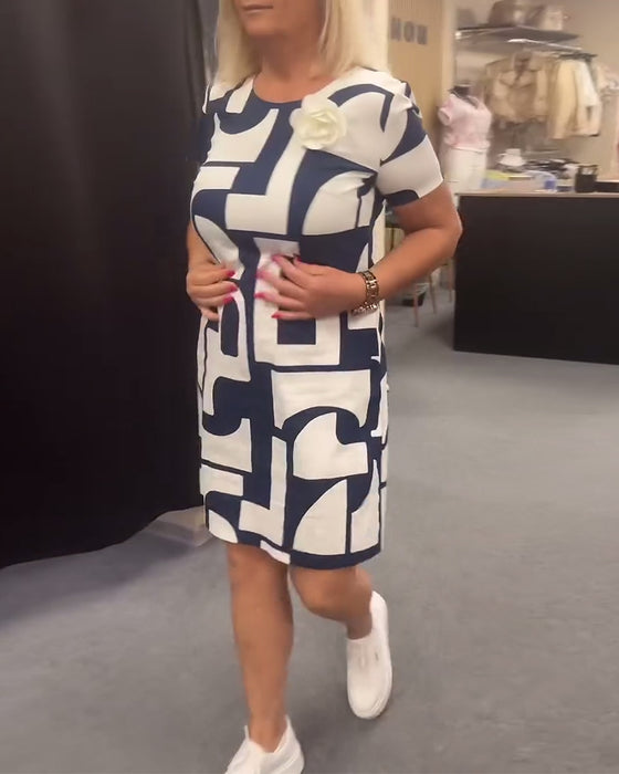 Jurk met ronde hals en zak met geometrische print