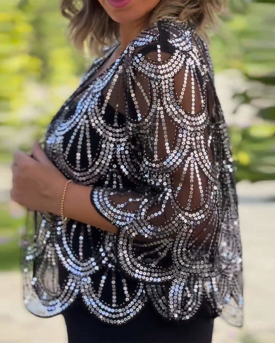 Elegante jas met lovertjes en golvende rand