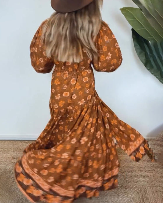 Vintage bloemenprint jurk met V-hals en lantaarnmouw