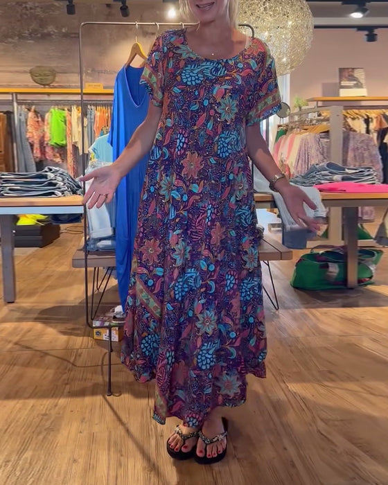 Lange jurk met korte mouwen en ronde hals met print