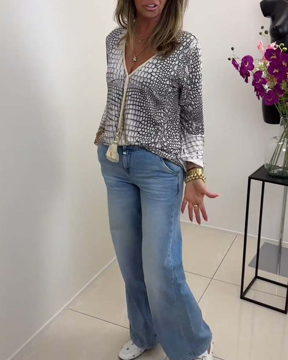 Blouse met bloemmotief en koord