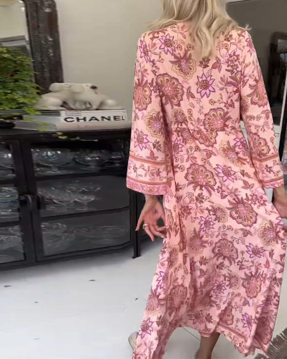 Elegante jurk met V-hals, knoopsluiting en trekkoord met print