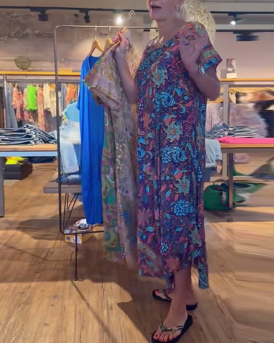 Lange jurk met korte mouwen en ronde hals met print