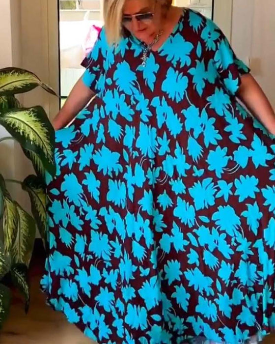 Losse jurk met V-hals en zak met bloemenprint