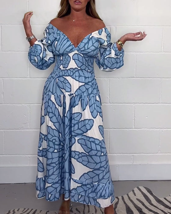 Lange damesjurk met V-hals en print in de taille