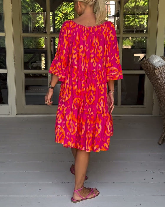 Jurk met losse print en klokmouwen
