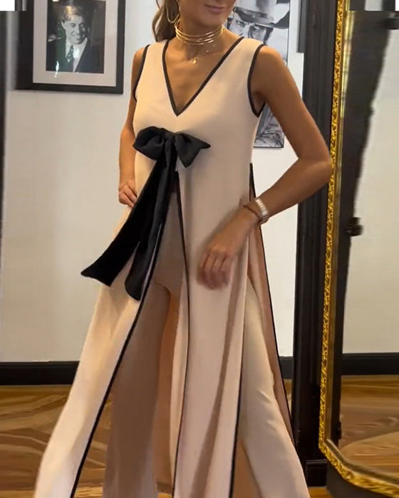 Elegant mouwloos pak in effen kleur met strik