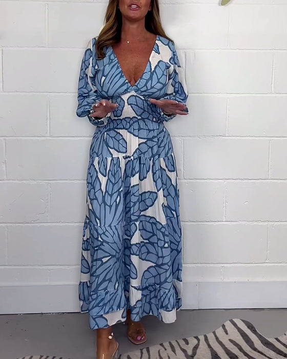 Lange damesjurk met V-hals en print in de taille