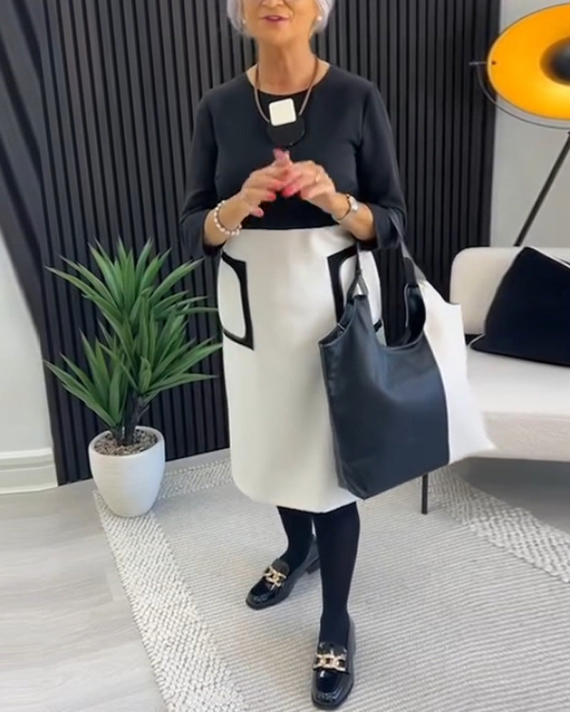 Casual contrasterende jurk met ronde hals en zak