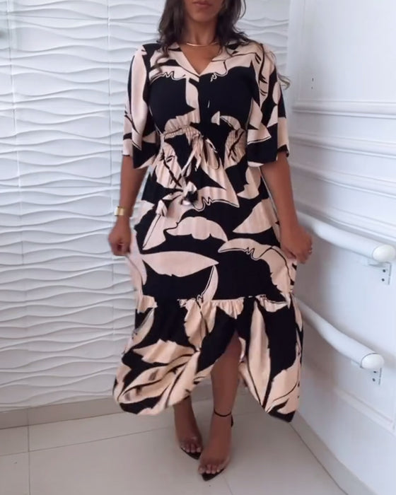 Elegante jurk met V-hals, driekwart mouw en trekkoord