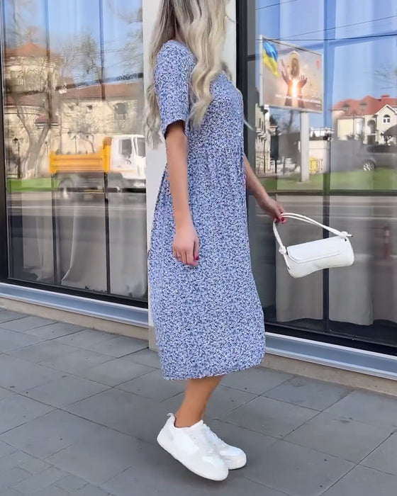 Jurk met bloemenknopen en middenmouwen