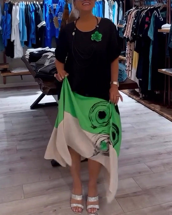 Losse patchworkjurk met ronde hals en kleurenprint