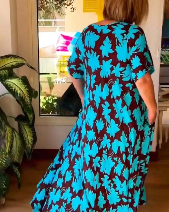 Losse jurk met V-hals en zak met bloemenprint