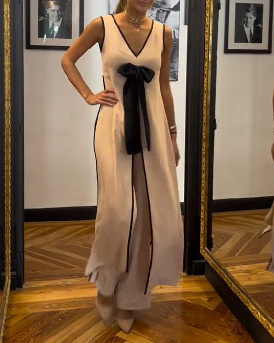 Elegant mouwloos pak in effen kleur met strik