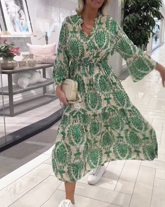 Jurk met trekkoord en klokmouwen met print