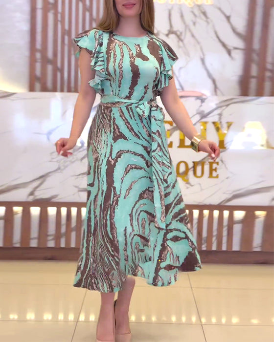 Elegante jurk met contrasterende print en ruches