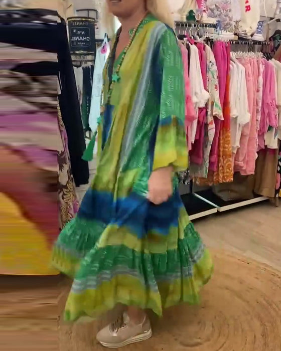 Casual lange jurk met V-hals, uitlopende mouwen en print