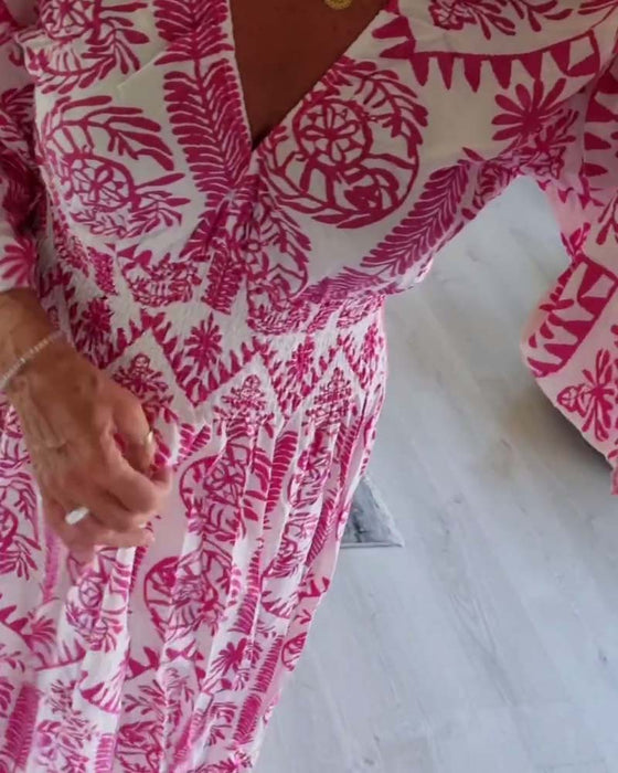 Elegante jurk met geplooide klokmouwen en V-hals met print