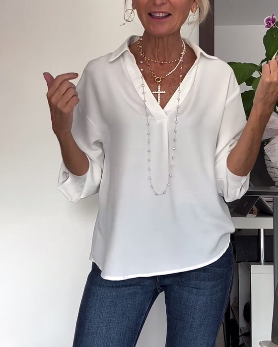 Eenvoudig topje met revers en lange mouwen in effen kleur