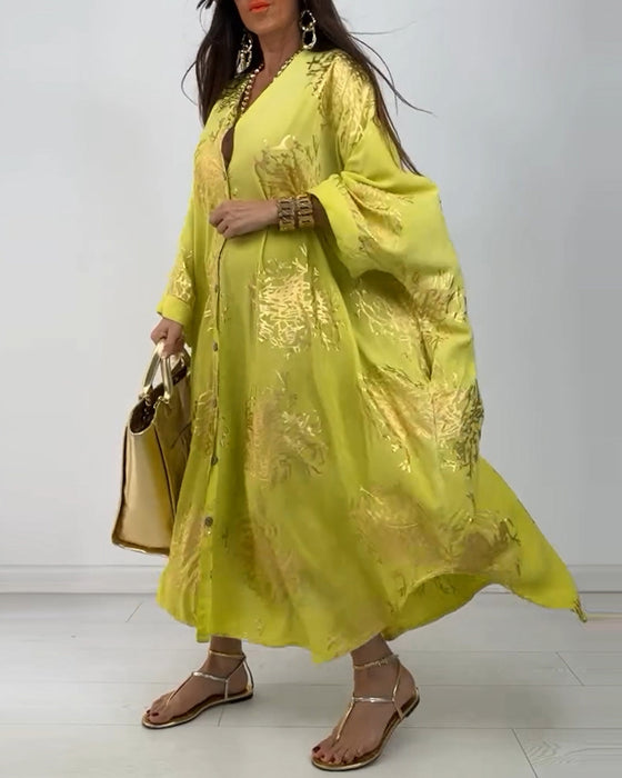 Losse jurk met lange mouwen en knoopsluiting