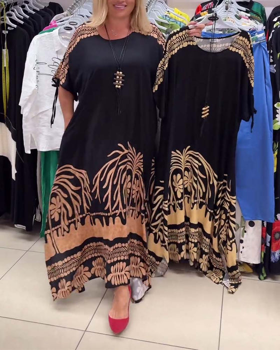 Losse jurk met ronde hals, korte mouwen en veters met print