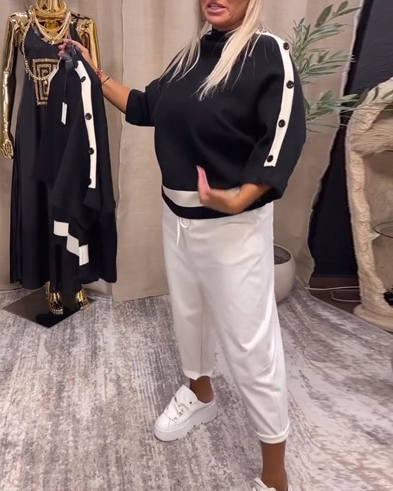 Pullover-trui met kleurblokken en knopen