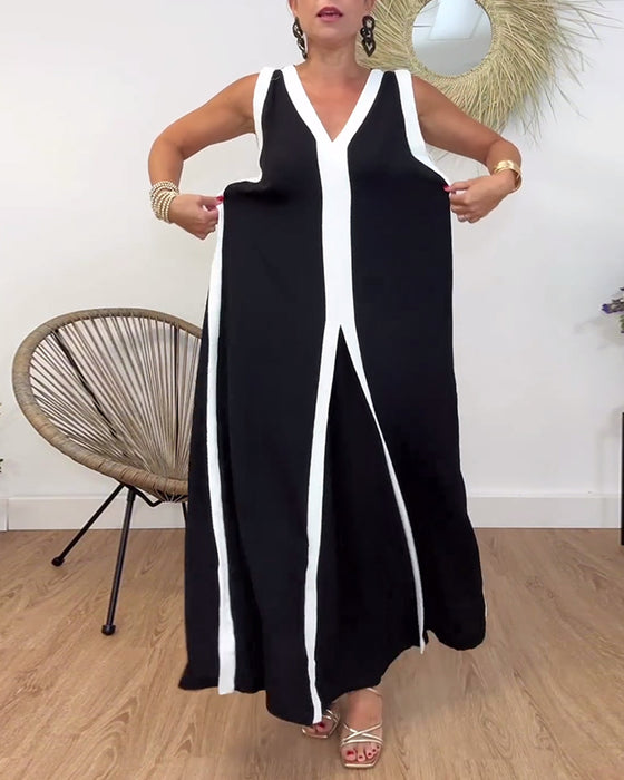 Modieuze mouwloze jurk met V-hals en contrasterende print