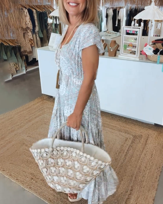 Jurk met V-hals en splitmouwen met vakantieprint