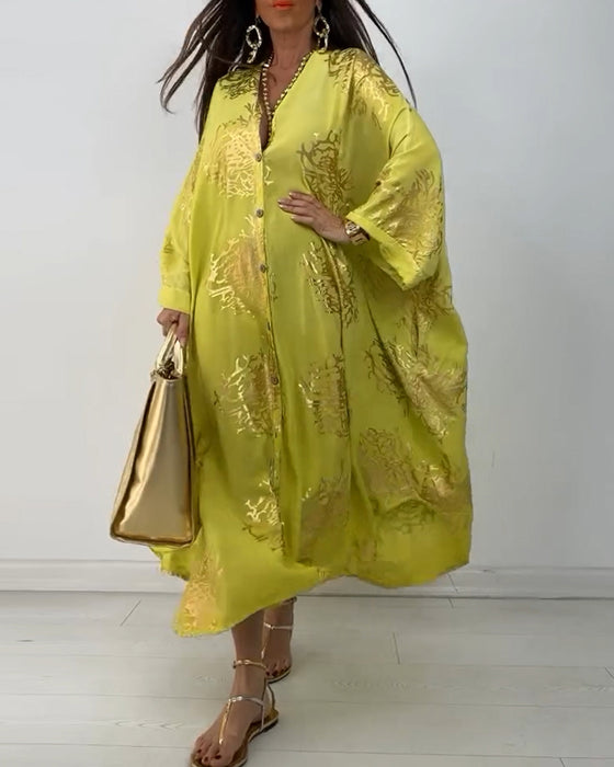 Losse jurk met lange mouwen en knoopsluiting