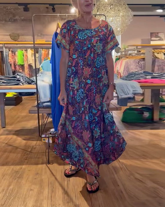 Lange jurk met korte mouwen en ronde hals met print