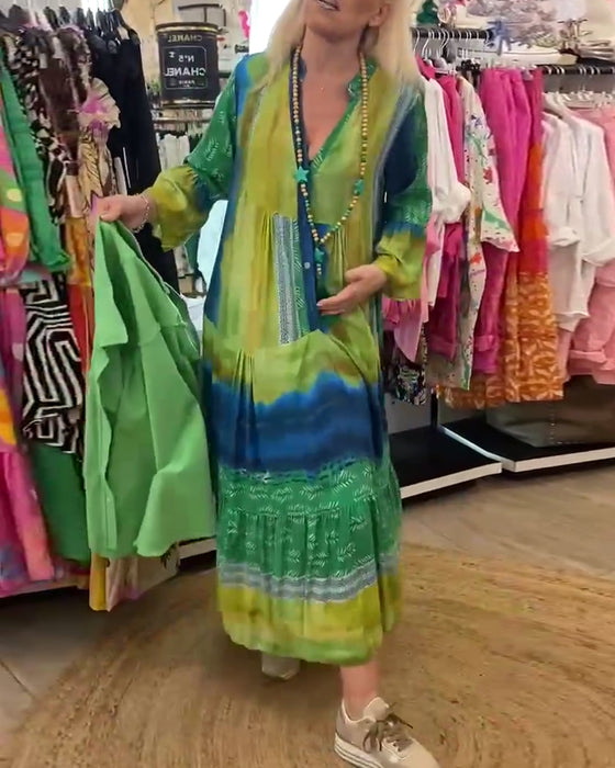 Casual lange jurk met V-hals, uitlopende mouwen en print